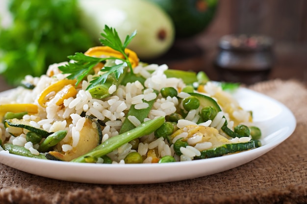 Risotto with asparagus beans, zucchini and green peas