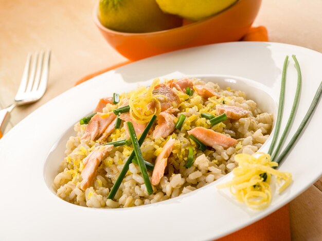 Risotto with fresh salmon chive and lemon peel healthy food