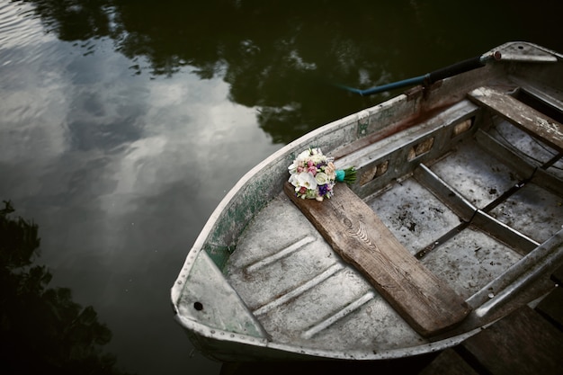 River boat with a bouquet of the bride