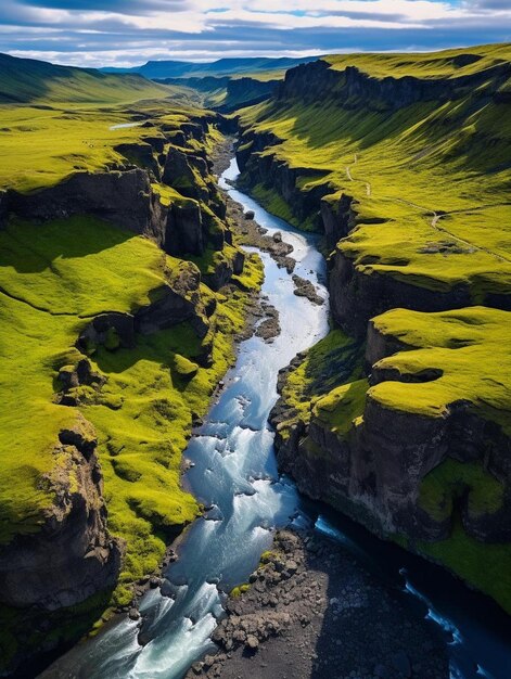 a river flowing through a lush green valley