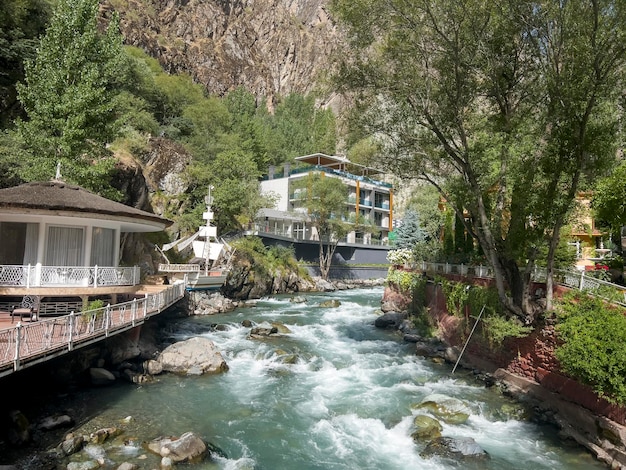 The river flows through the garden of a villa