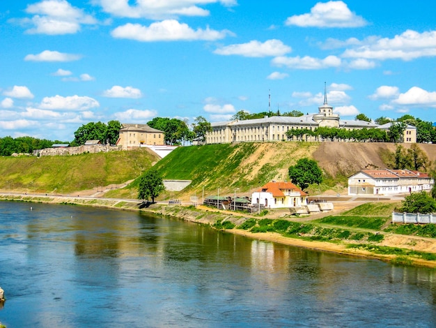 River Grodno castle steep bank Neman A river with a river and a building in the background