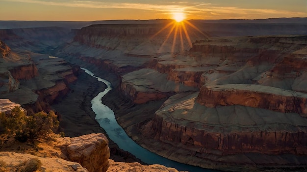 Photo a river runs through a canyon with a sunset in the background