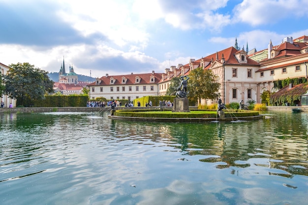 a river runs through a city with a large building in the background Czech Republic Prague Sights