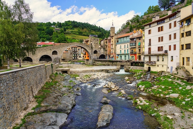 River Ter as it passes through the medieval village of Camprodon with its ancient stone bridge Gerona