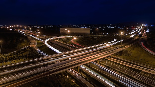 Over Road city highway at night Bird eye viwe drone Top view