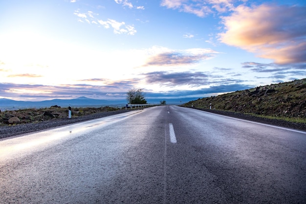 The road curves beautifully in the evening