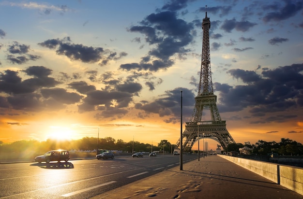 Road to Eiffel Tower at sunny sunrise in Paris, France