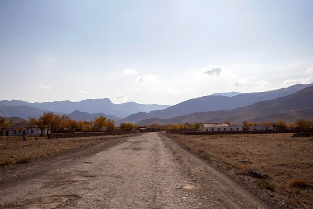 Road houses fields in the mountains