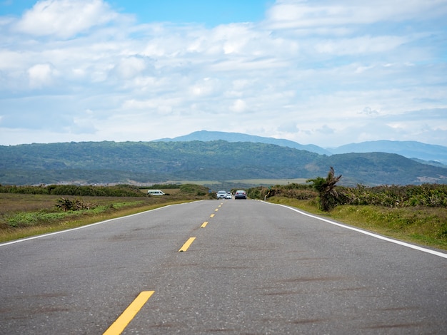 Road in Kenting with on the horizon mountains and coast.