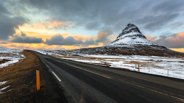 Road to Kirkjufell under cloud sky at dusk