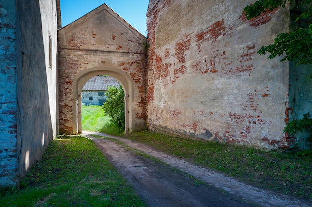 The road leading through the arch to the manor Approach and gateway to the manor ruins