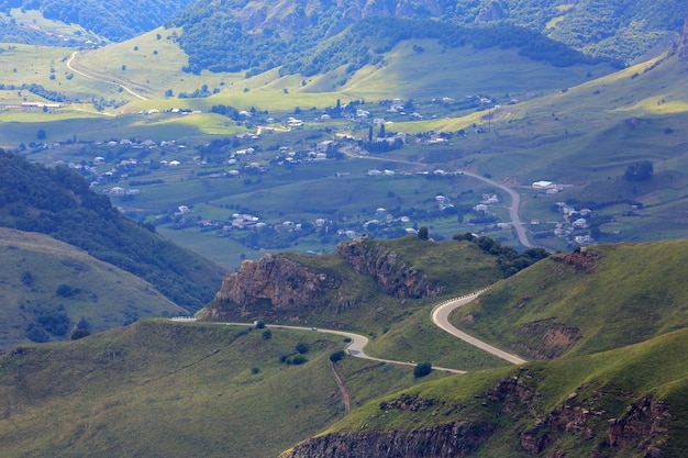 Road in a mountain valley. Photographed in the Caucasus, Russia.