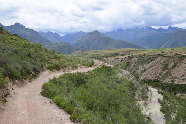 The road between the mountains to the salt terraces of Maras in the Andes mountain range in the region of Cusco Peru