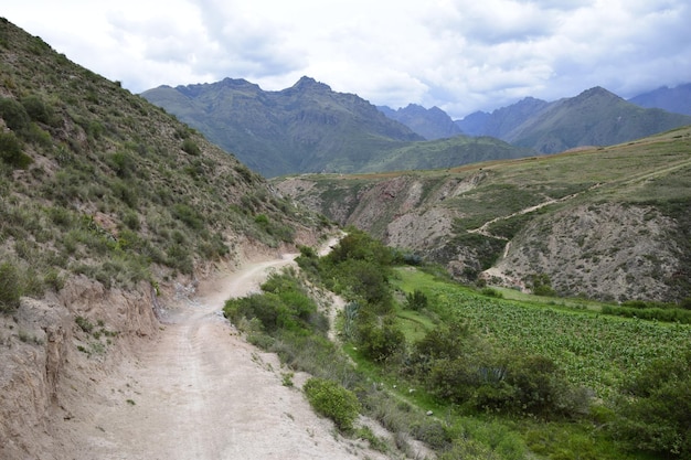 The road between the mountains to the salt terraces of Maras in the Andes mountain range in the region of Cusco Peru