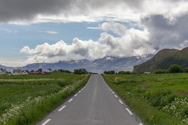 Road passing in a valley between mountains in Norway