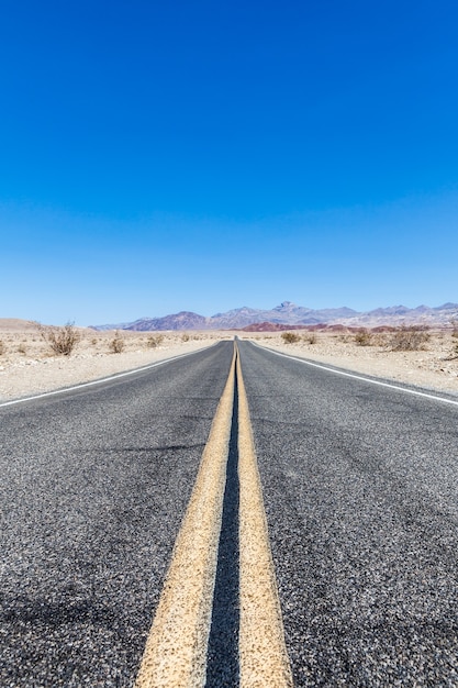 Road prospective in the middle of Death Valley desert, USA