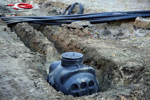 Road repair Laying the electrical network and communications infrastructure under the road surface