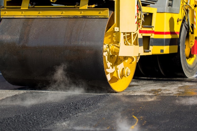 Road roller compacting asphalt