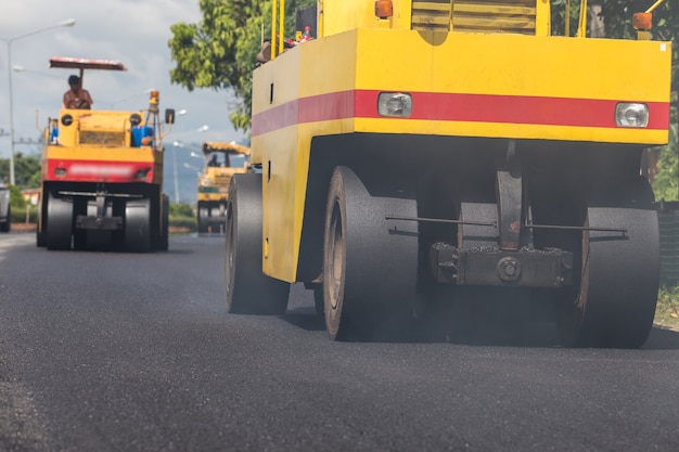 Road roller working on the new road construction site