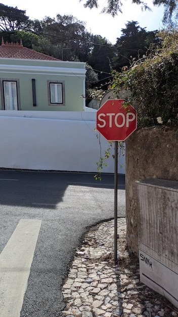 Road stop sign at the intersection of one street in the tourist part of Portugal Sintra