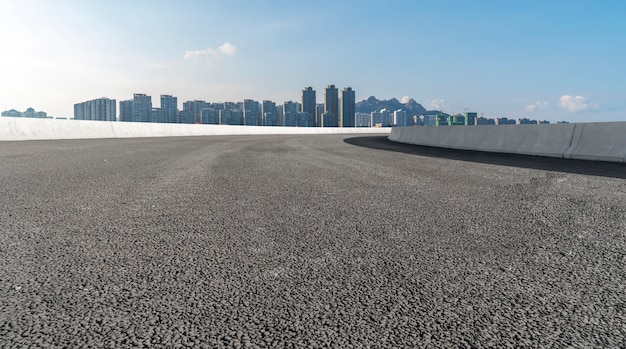 Road surface and urban architectural landscape skyline