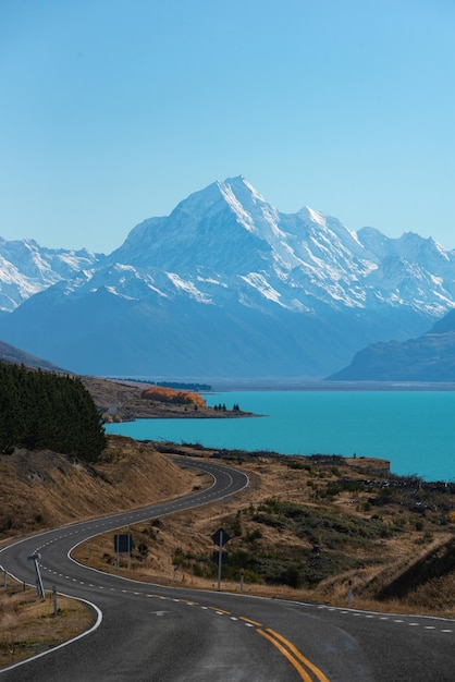 a road that has a mountain in the background