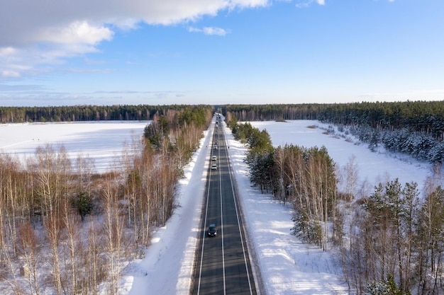 Road in the winter Alps. Winter landscape. Aerial view