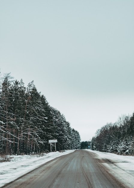 road in winter. beautiful road by the forest. Winter landscape. Empty road