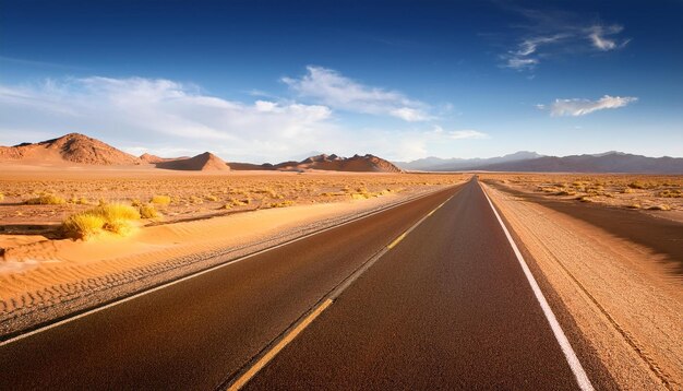 Photo a road with a desert in the background