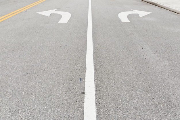 Road with direction signs Asphalt road marking