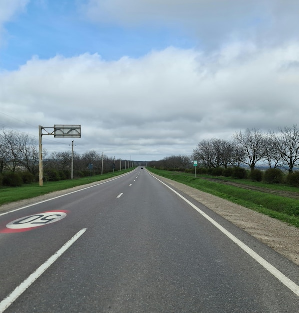 A road with a sign that says " speed limit " on it.