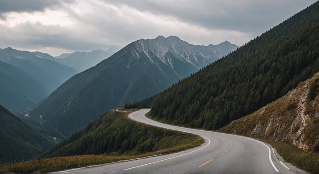 Photo a road with a view of a mountain range and a car driving through it