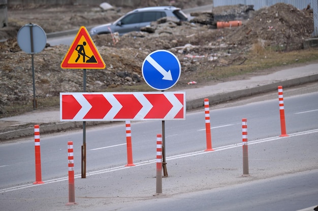 Roadworks warning traffic signs of construction work on city street