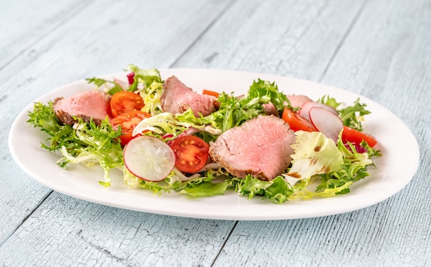 Roast beef salad on the serving plate