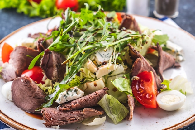 Roast beef salad  vegetables and cheese. Closeup