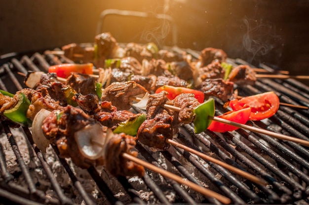 Roast beef skewers on a grill Roast beef skewers grilling on a grill Roast beef concept