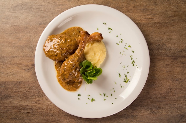 roast duck with mashed potato on the plate.