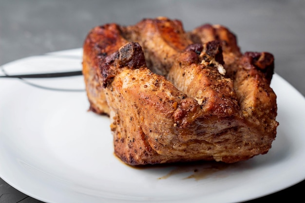 Roast pork loin on a white plate