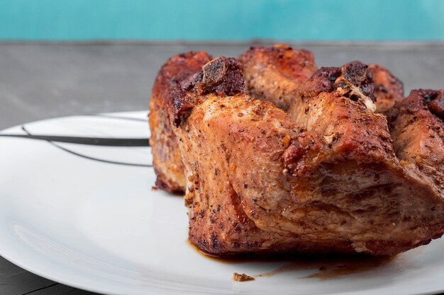 Roast pork loin on a white plate