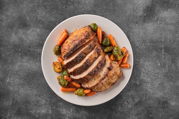 Roast pork with herbs and vegetables Grilled sliced Pork Loin