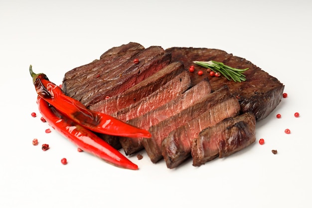 Roasted beef steaks on white background, close up