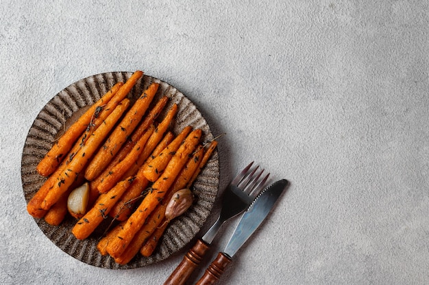 Roasted Carrots Ready to Eat Glazed carrot with herbs and garlic Fried carrot on white background Sauteed vegetables Comfort food Christmas garnish