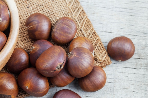 Roasted chestnuts on wooden.