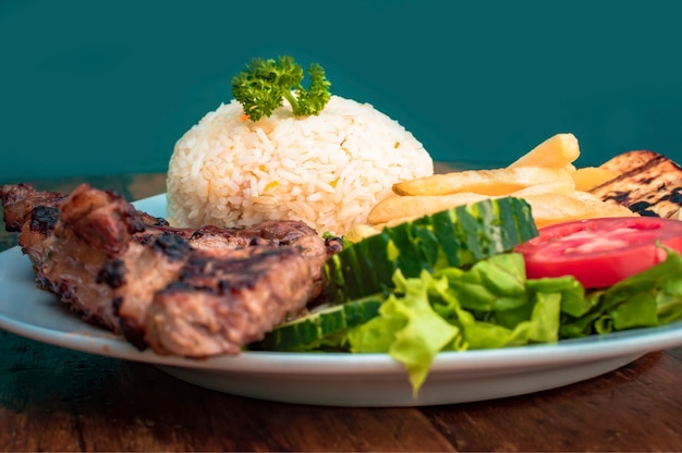 roasted chicken with gallo pinto and pico de gallo Nicaraguan food served on wooden background