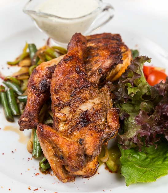 Roasted chicken with vegetables serving in restaurant