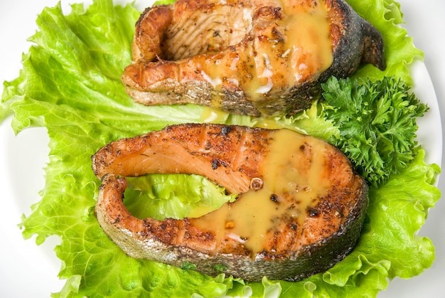 Roasted chum salmon fish dish isolated on a white background