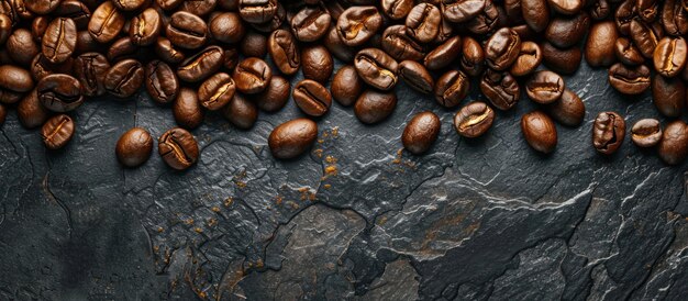 Roasted coffee beans on a black stone background