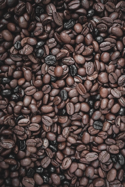 roasted coffee beans, brown background