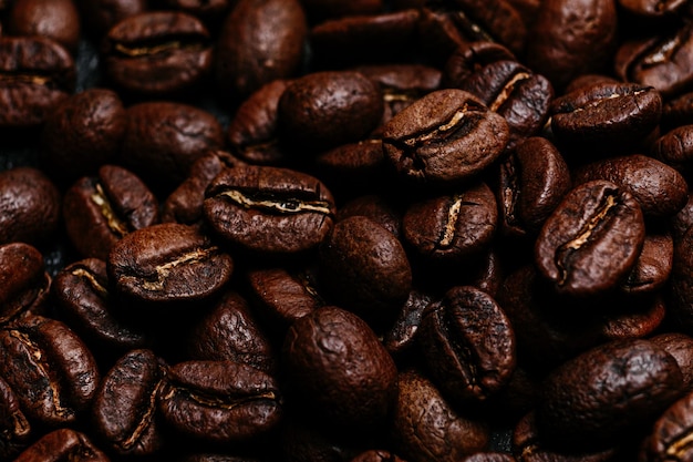 Roasted coffee beans closeup on a dark background Colombian coffee